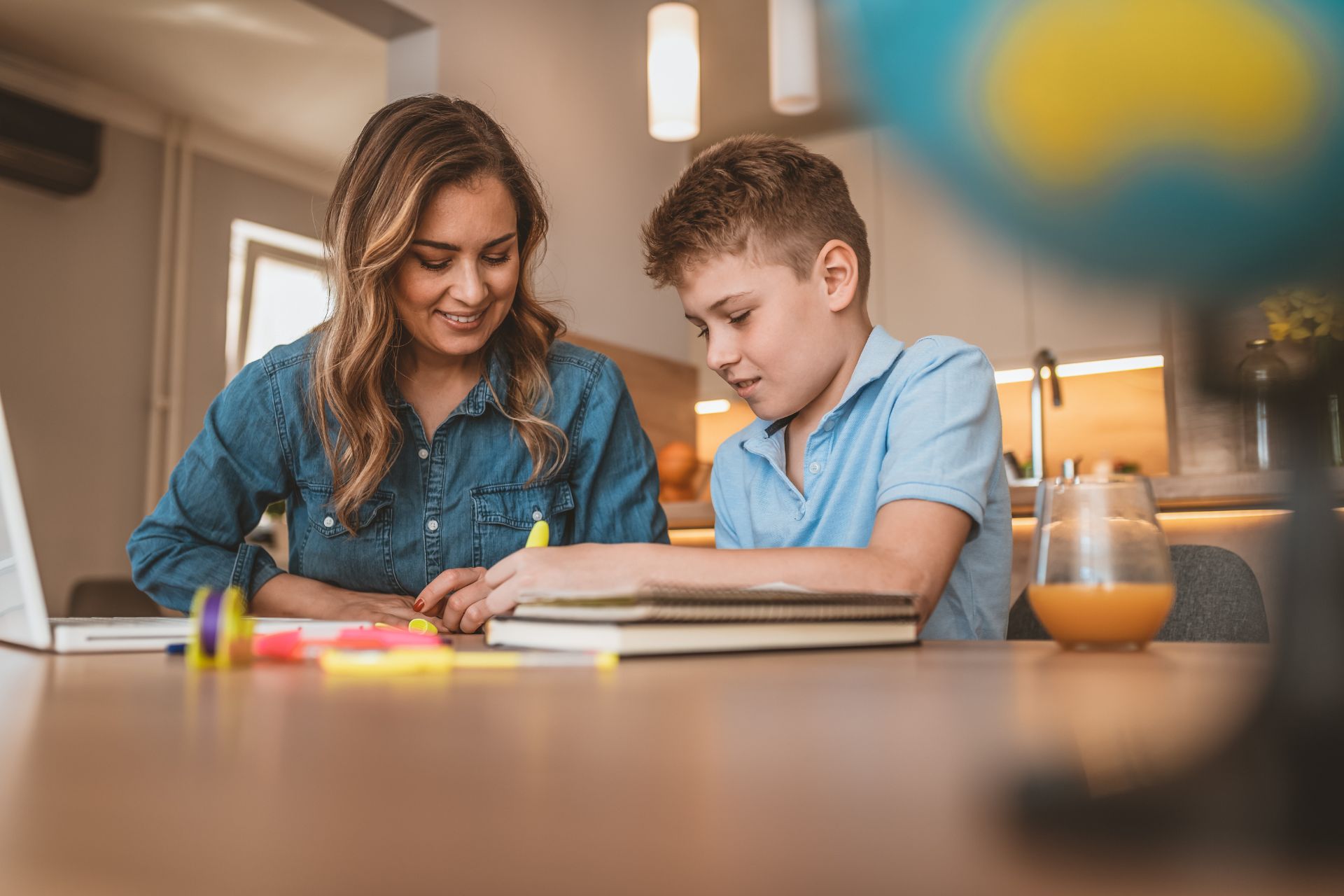 a mom doing homework with her son